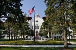 College hall with flag.